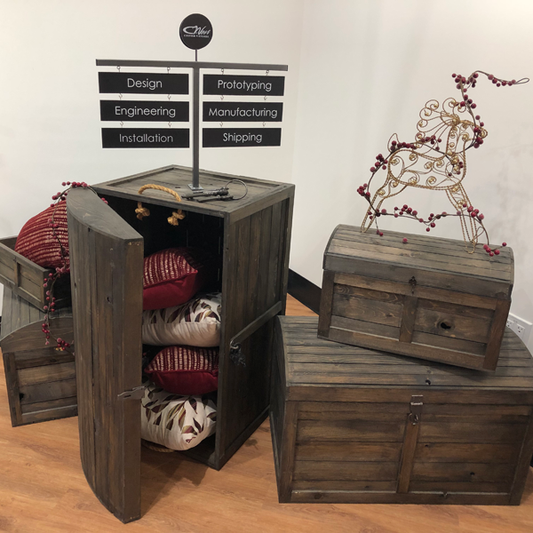 the rustic crate series 300 set up with the T sign holder for a Christmas holiday retail display. They are displaying pillows and a gold wire frame deer